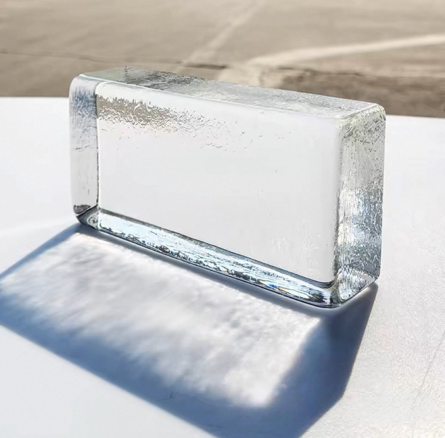 Dew Crest clear glass brick with delicate textured crest by MIOLISM