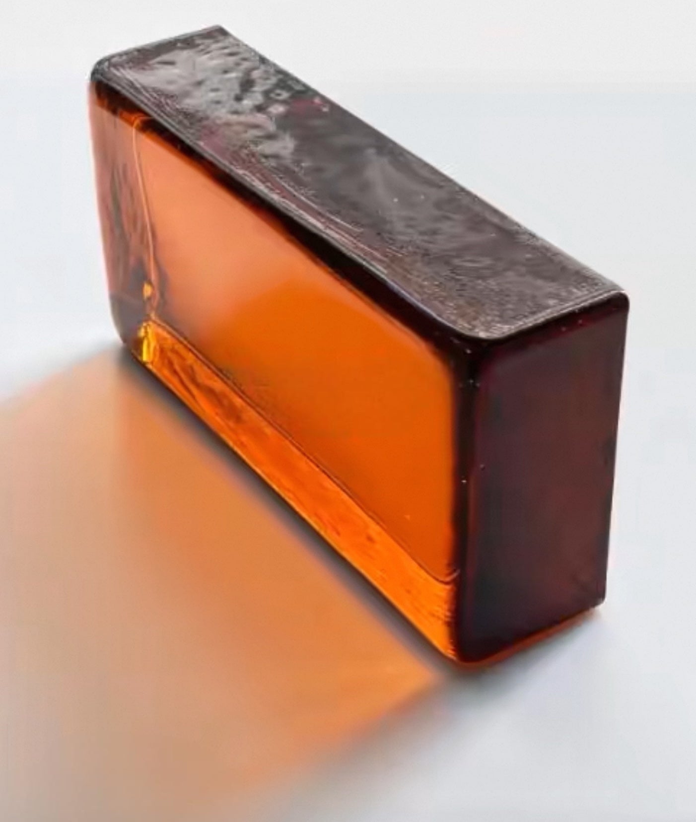 Amber Block golden translucent glass brick for luminous interiors by MIOLISM