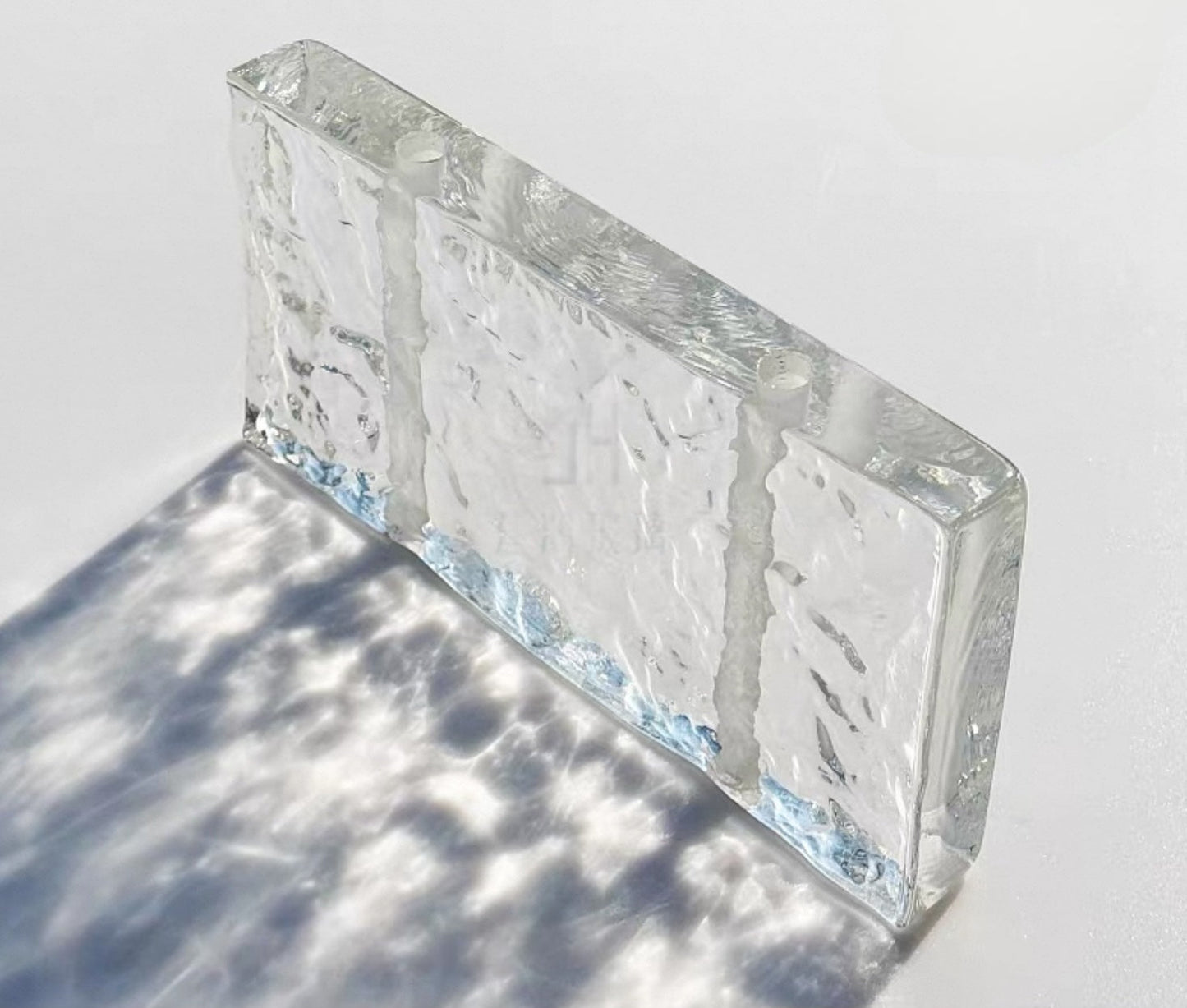 Perforated Single-Face Ice Crystal glass brick with slim textured face by MIOLISM