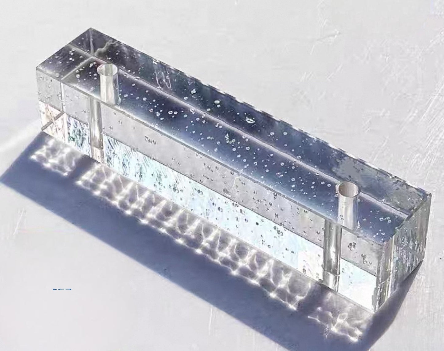 Perforated Polished Bubble Ripple glass brick with clear textured body by MIOLISM