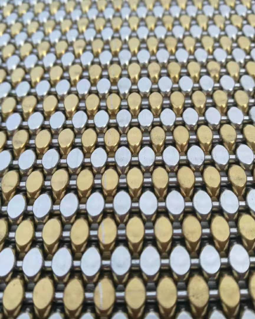 Close-up of a textured surface with gold and silver patterns