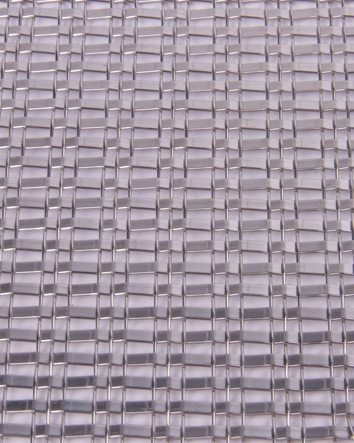 Close-up of a woven pattern with interlocking rectangular shapes in gray tones.