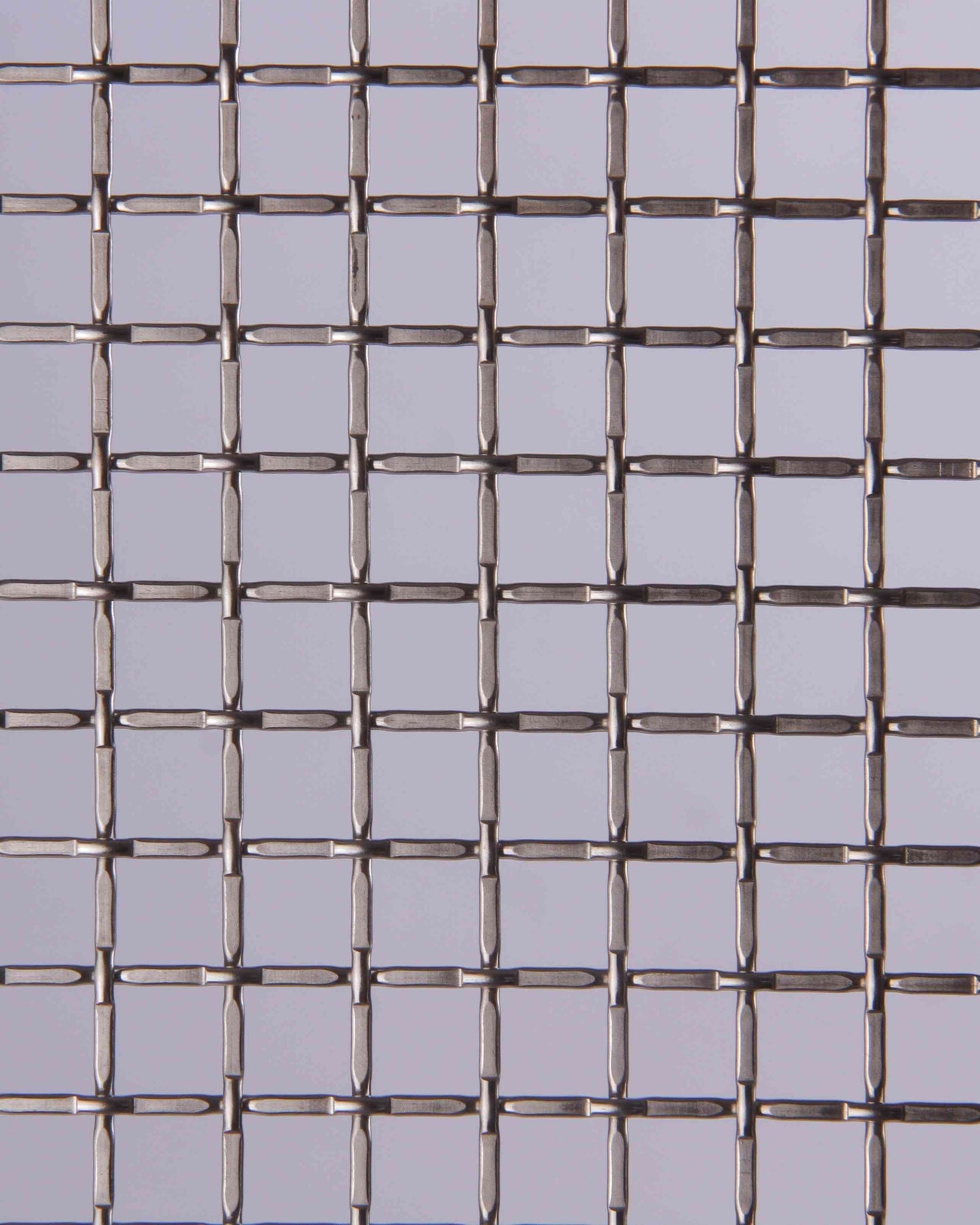 Metallic wire mesh on a gray background
