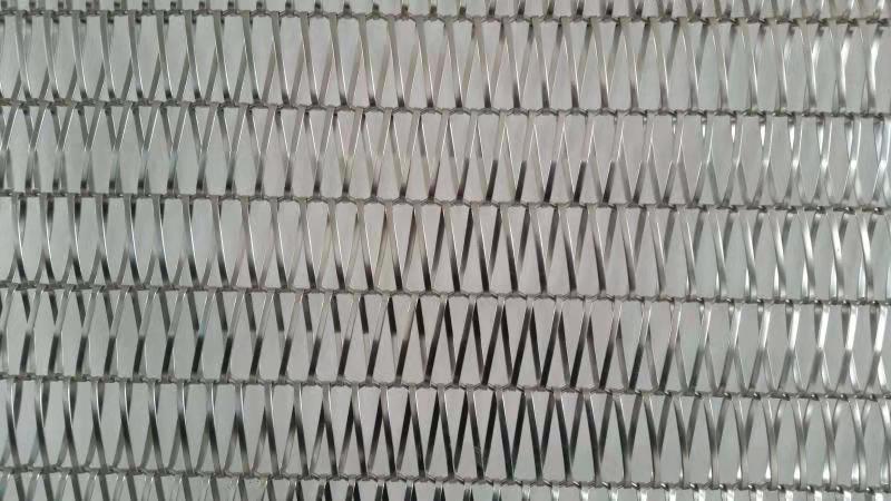 Metallic textured pattern with a zigzag design on a gray background