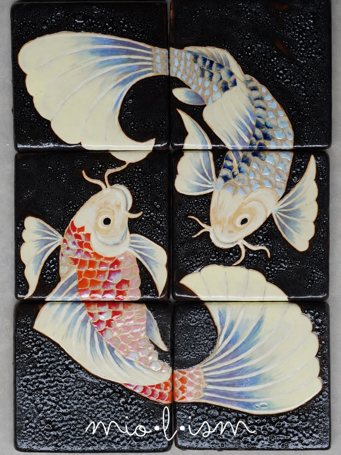 Handcrafted koi ceramic mural with artisan tile art, layered glazes, and black glazed ceramic surface