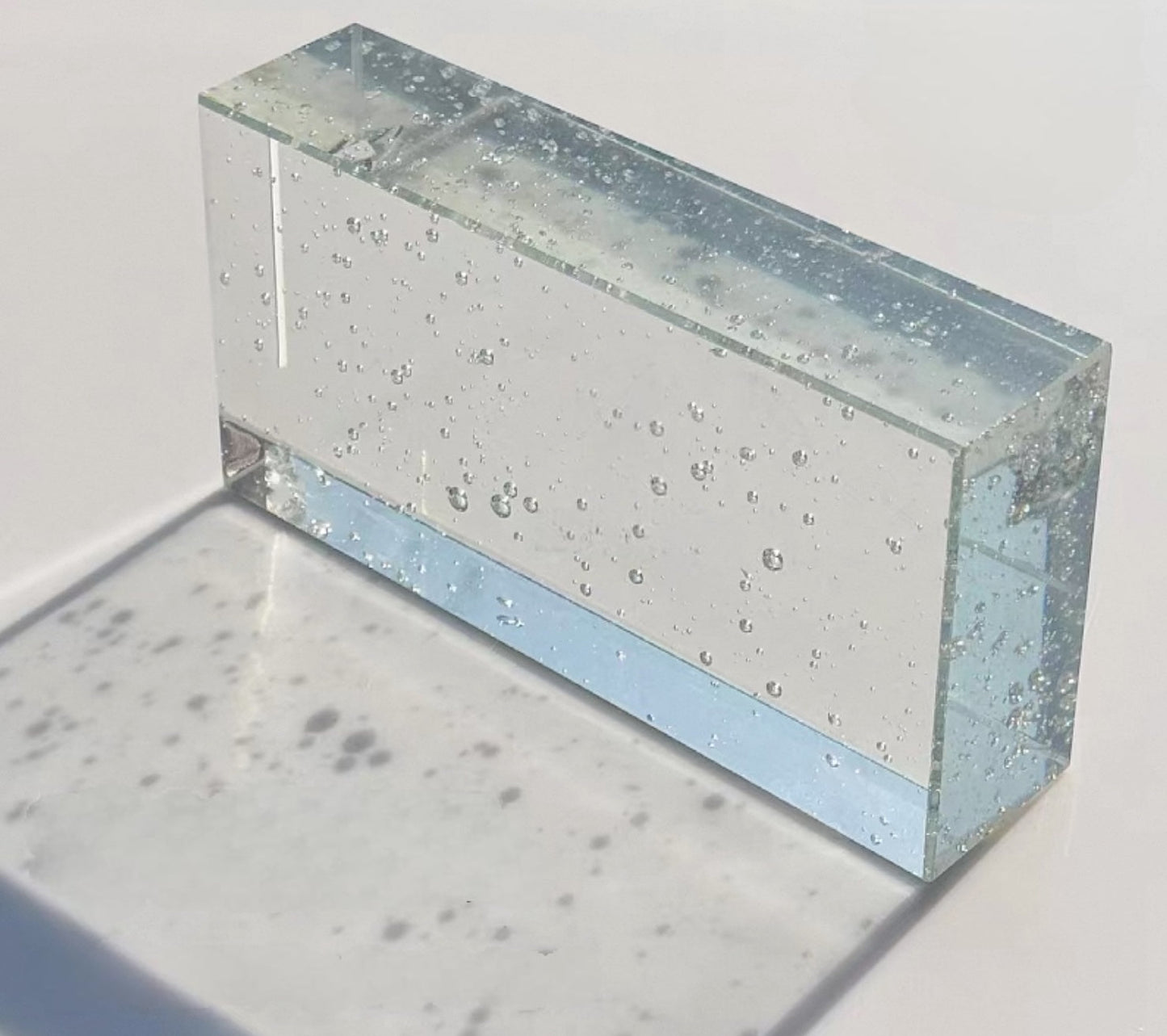 Bubble Prism clear glass brick with embedded air bubble texture by MIOLISM