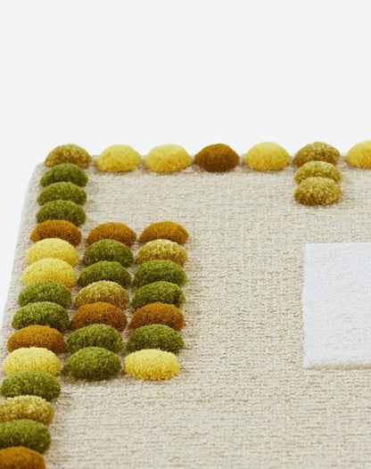 Pom Border Handwoven Rug – Olive & Ochre