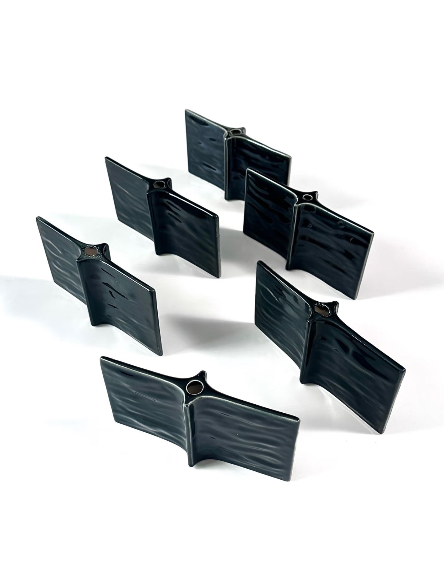 Set of black plastic clips on a white background
