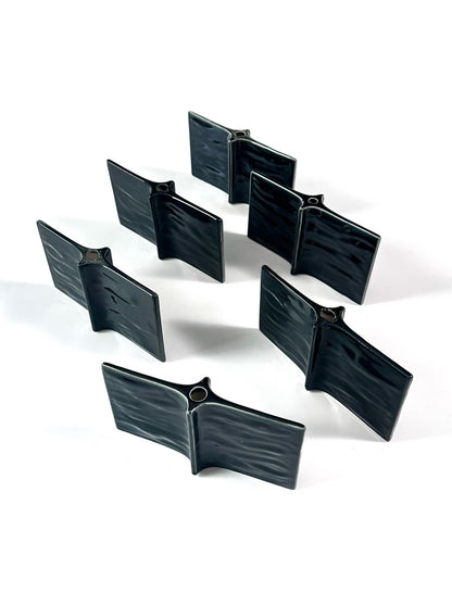 Set of black plastic clips on a white background