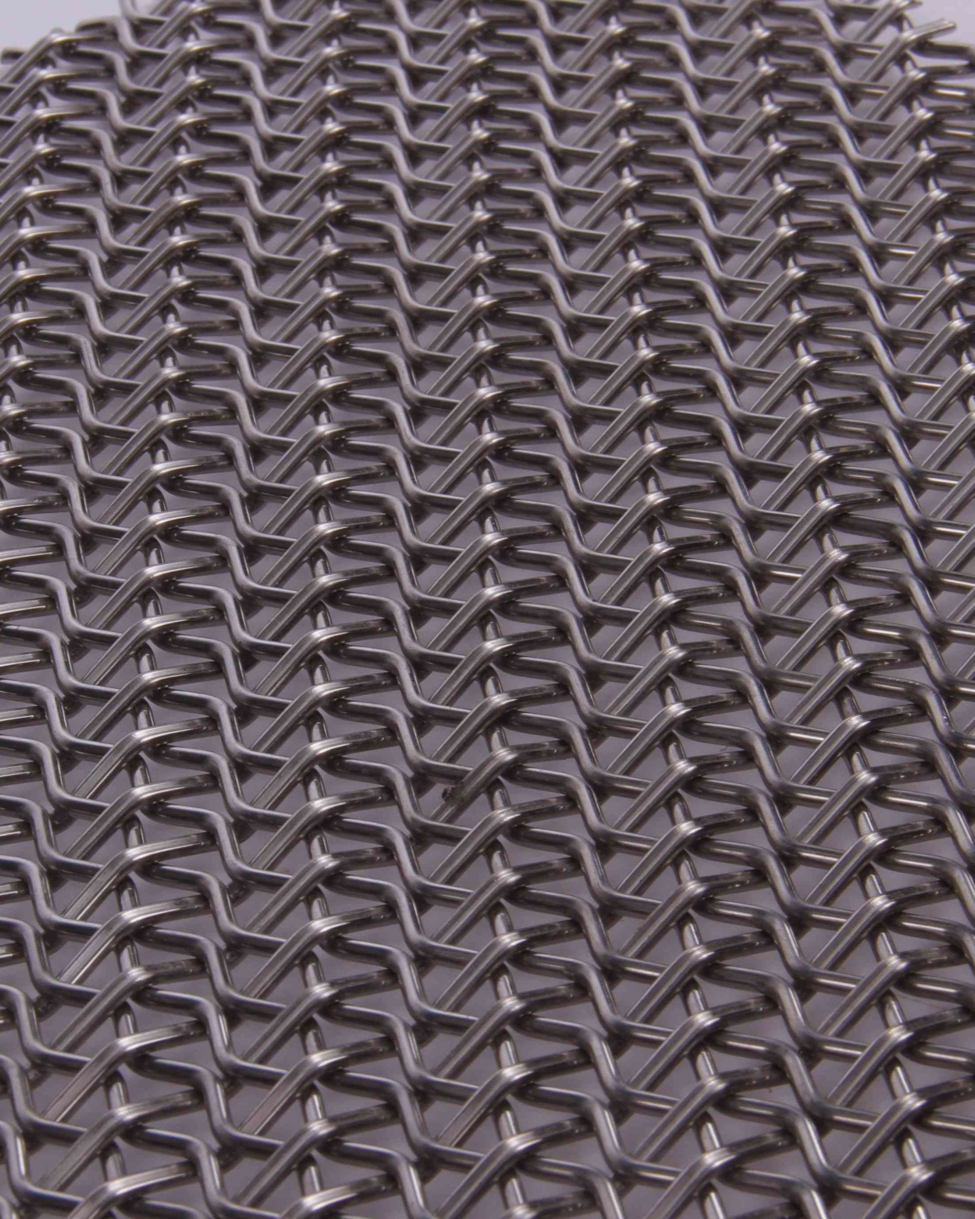 Close-up of a metal mesh with a diamond pattern
