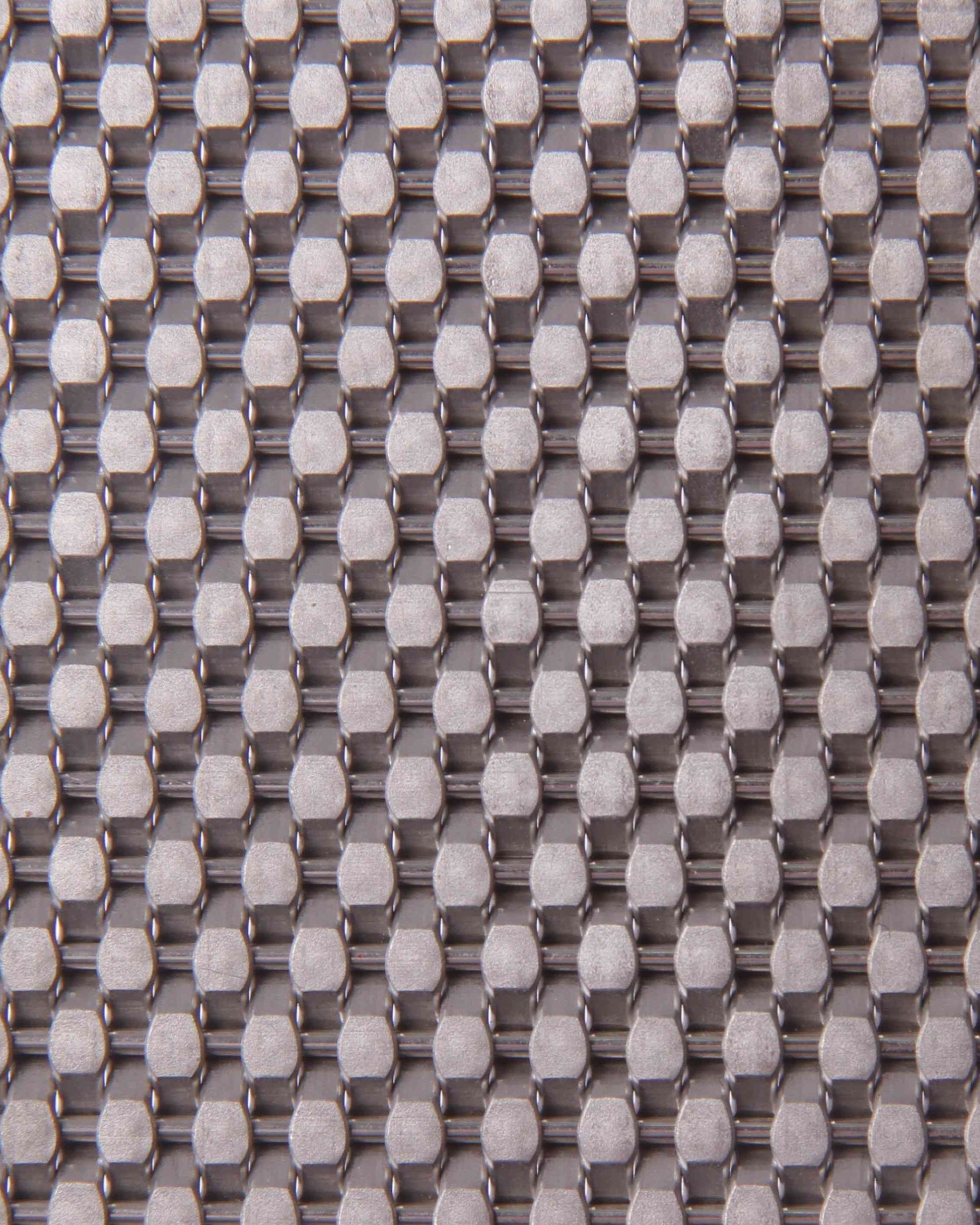 Close-up of a textured fabric with a grid pattern in gray and white.