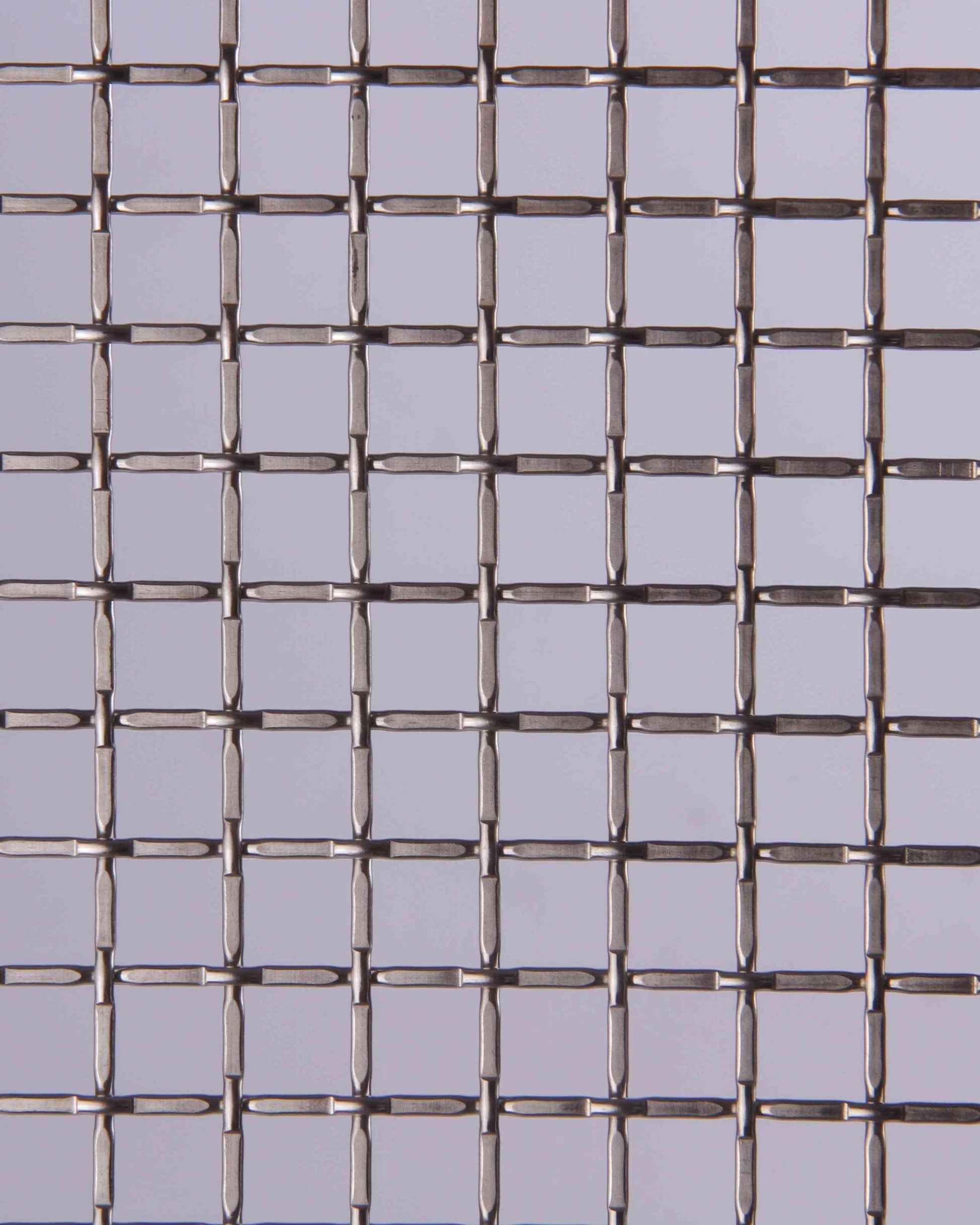 Metallic wire mesh on a gray background