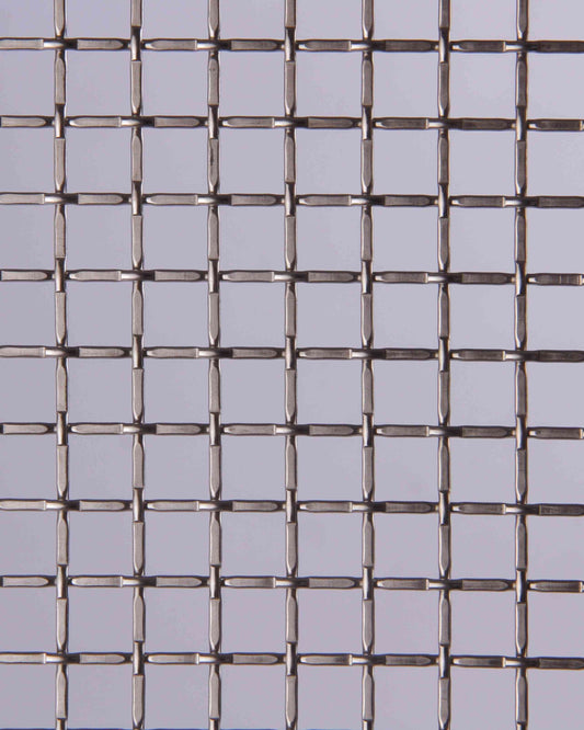 Metallic wire mesh on a gray background