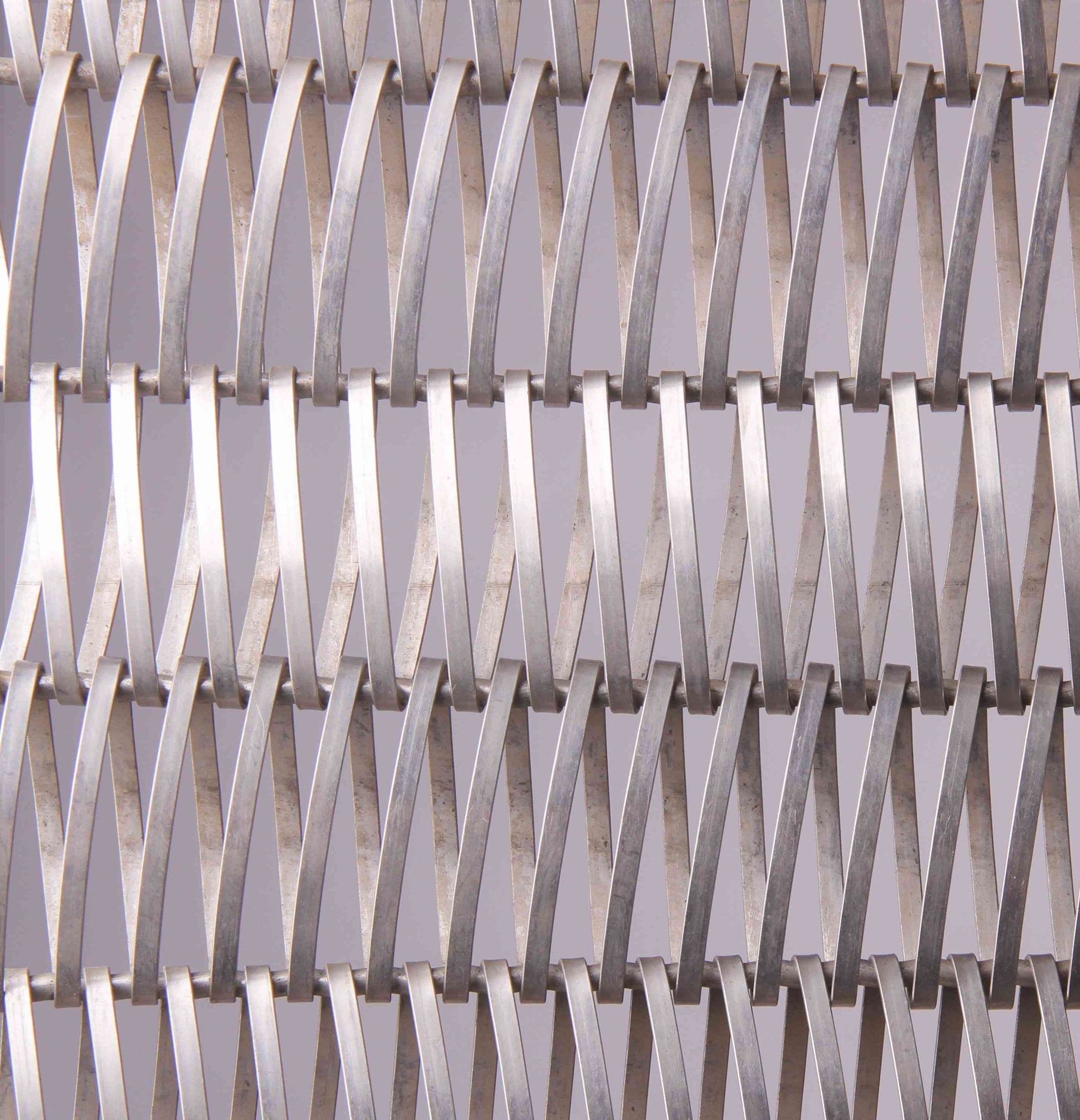 Close-up of a metal mesh with a geometric pattern