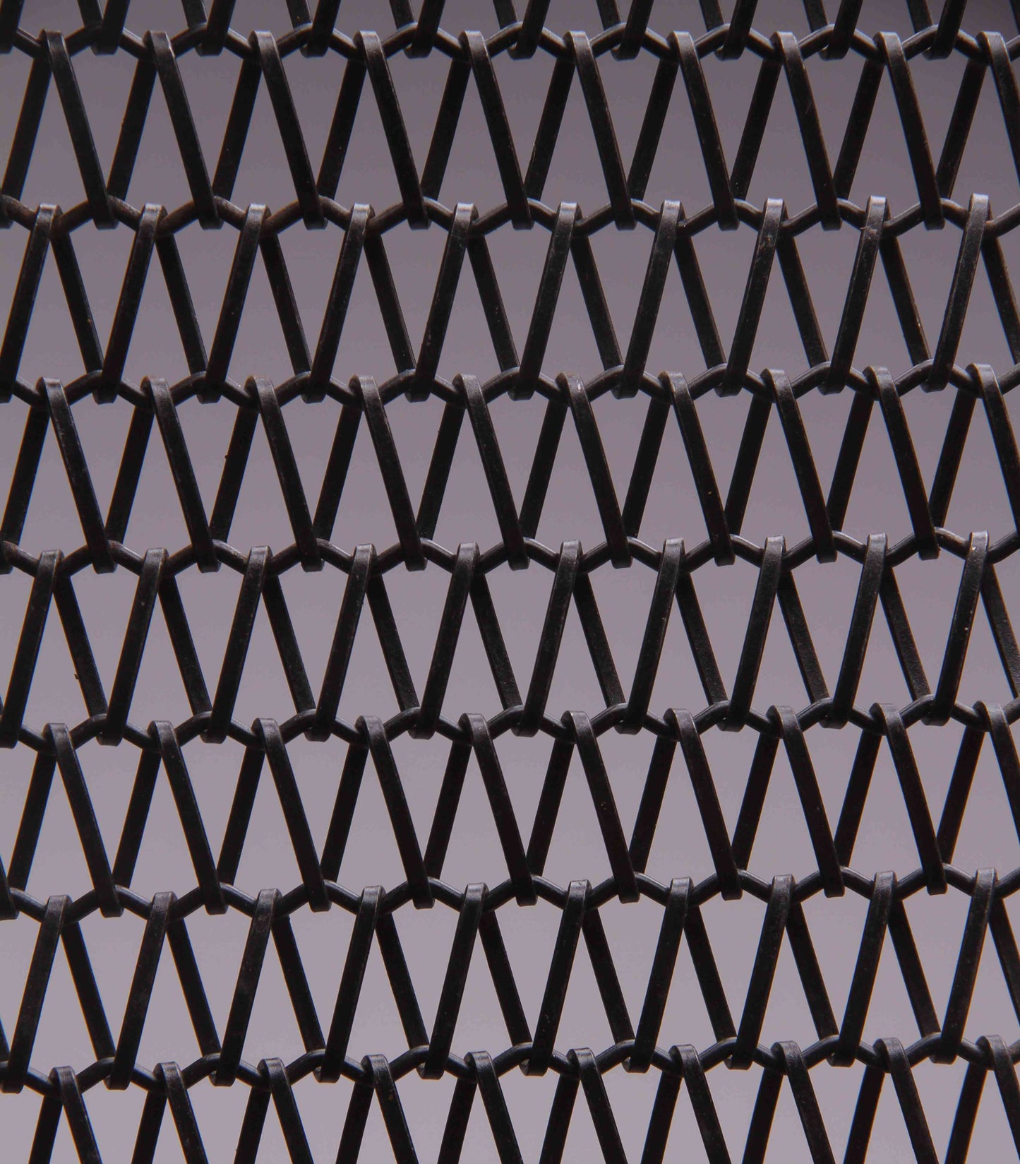 Black woven pattern on a gray background