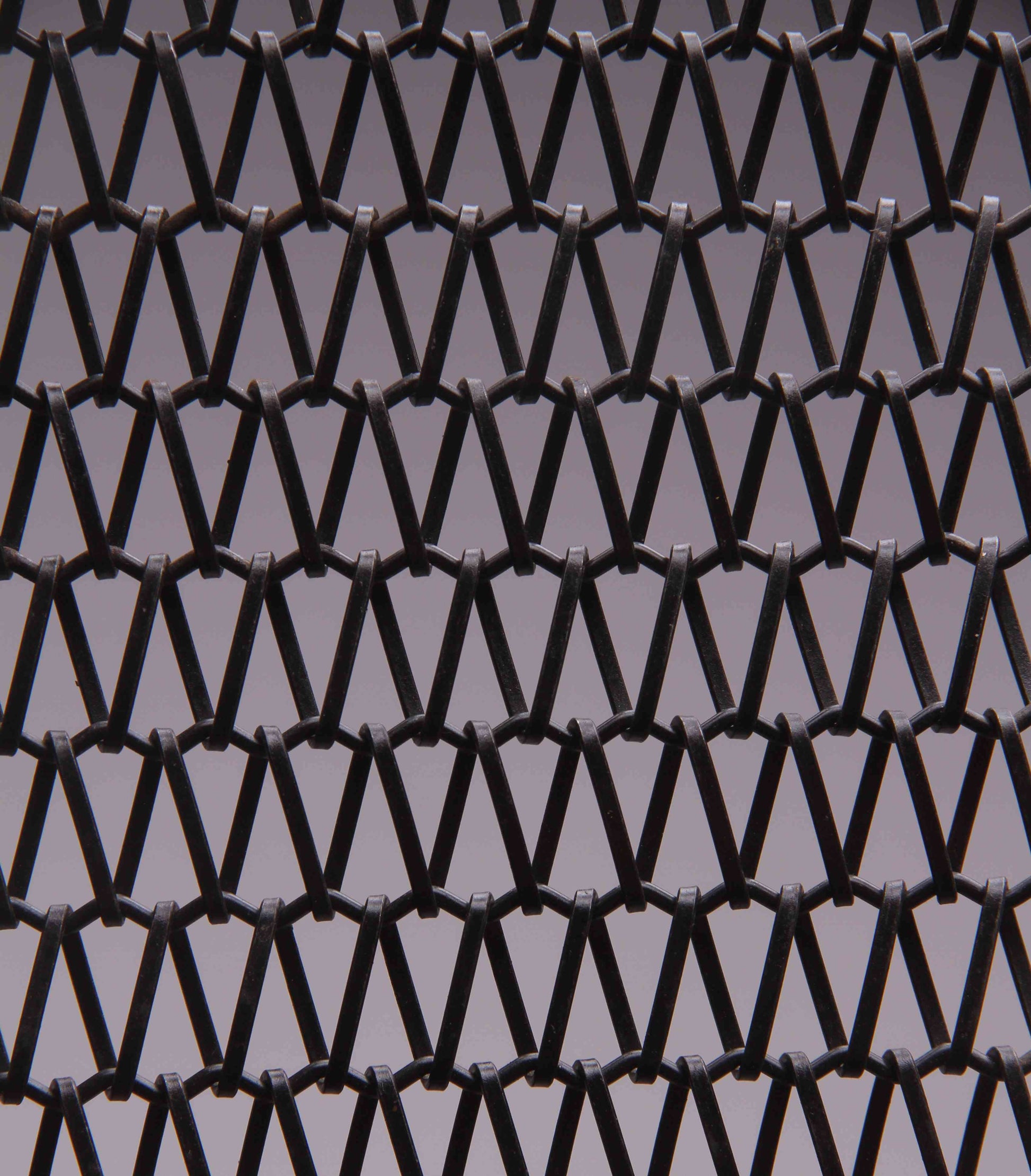 Black woven pattern on a gray background