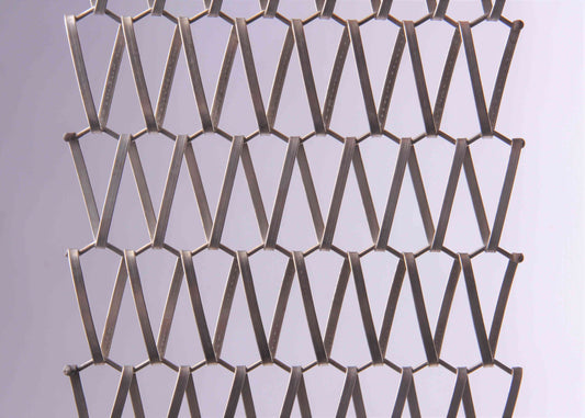 Metallic mesh pattern on a light gray background